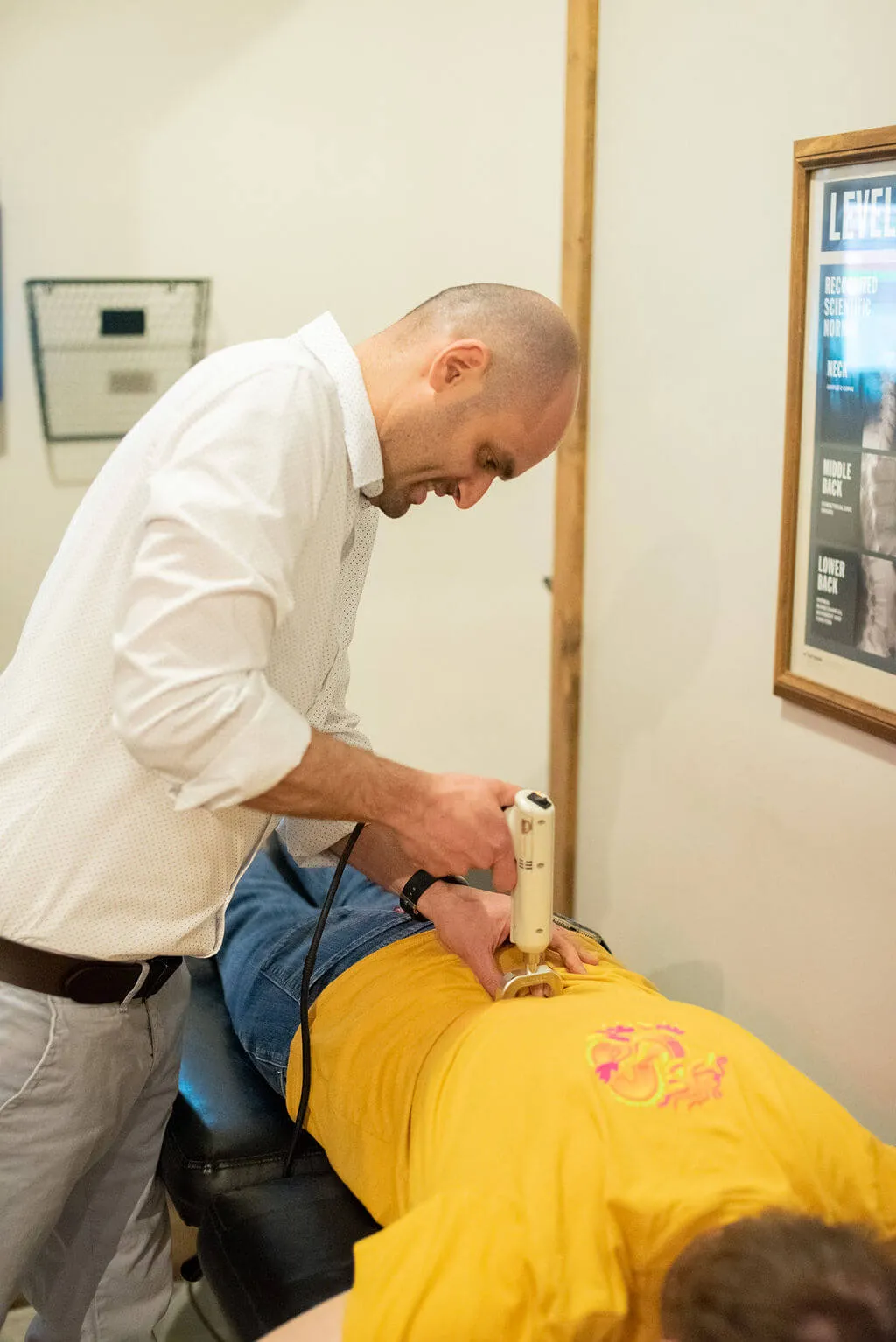 Chiropractor with patient